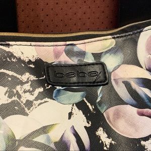 BEBE Floral clutch purse makeup bag with fringe zipper